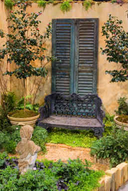 Use an old window shutter as a garden decoratio